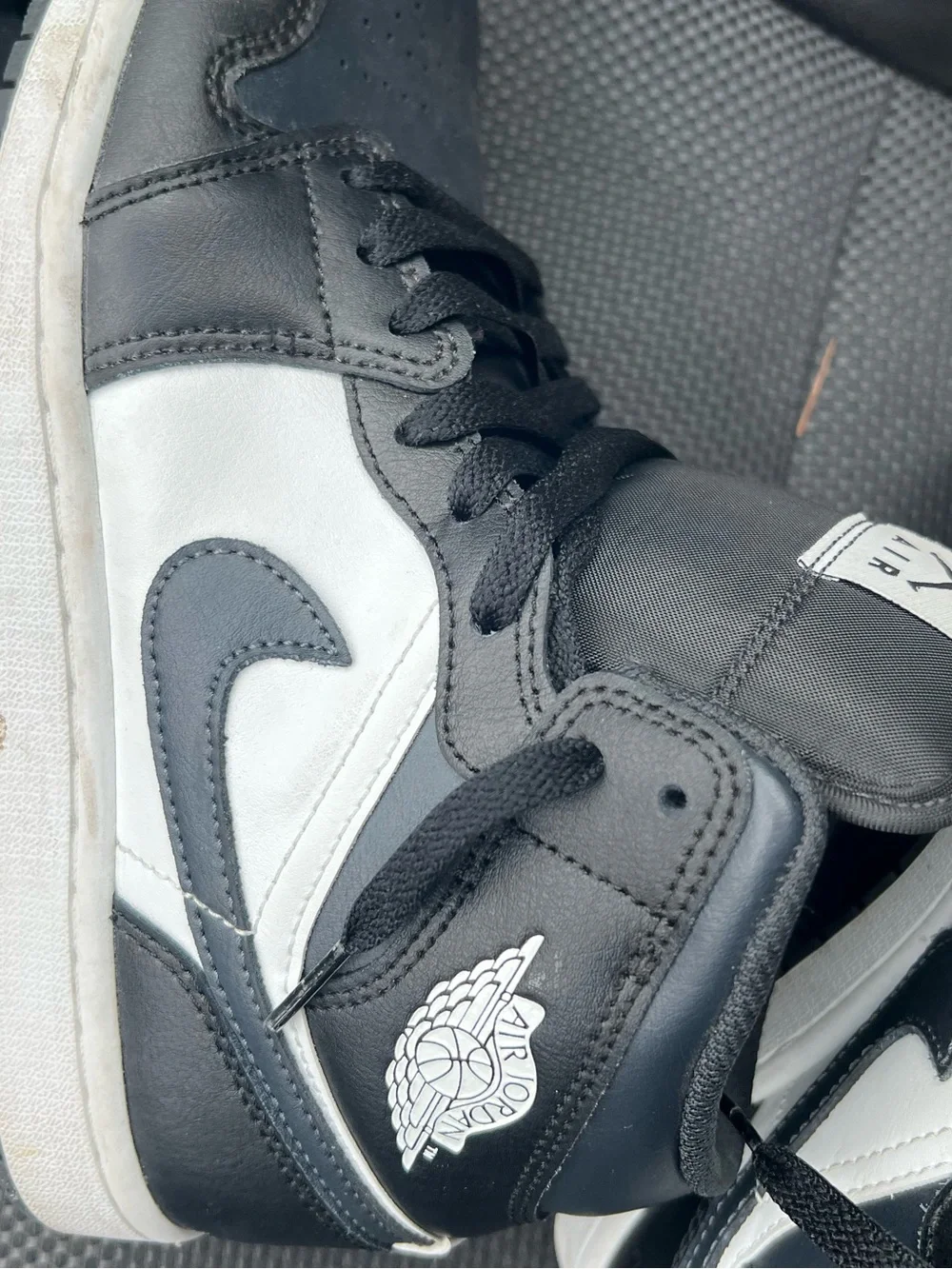 Jordan Black and White Mid-Top Sneakers